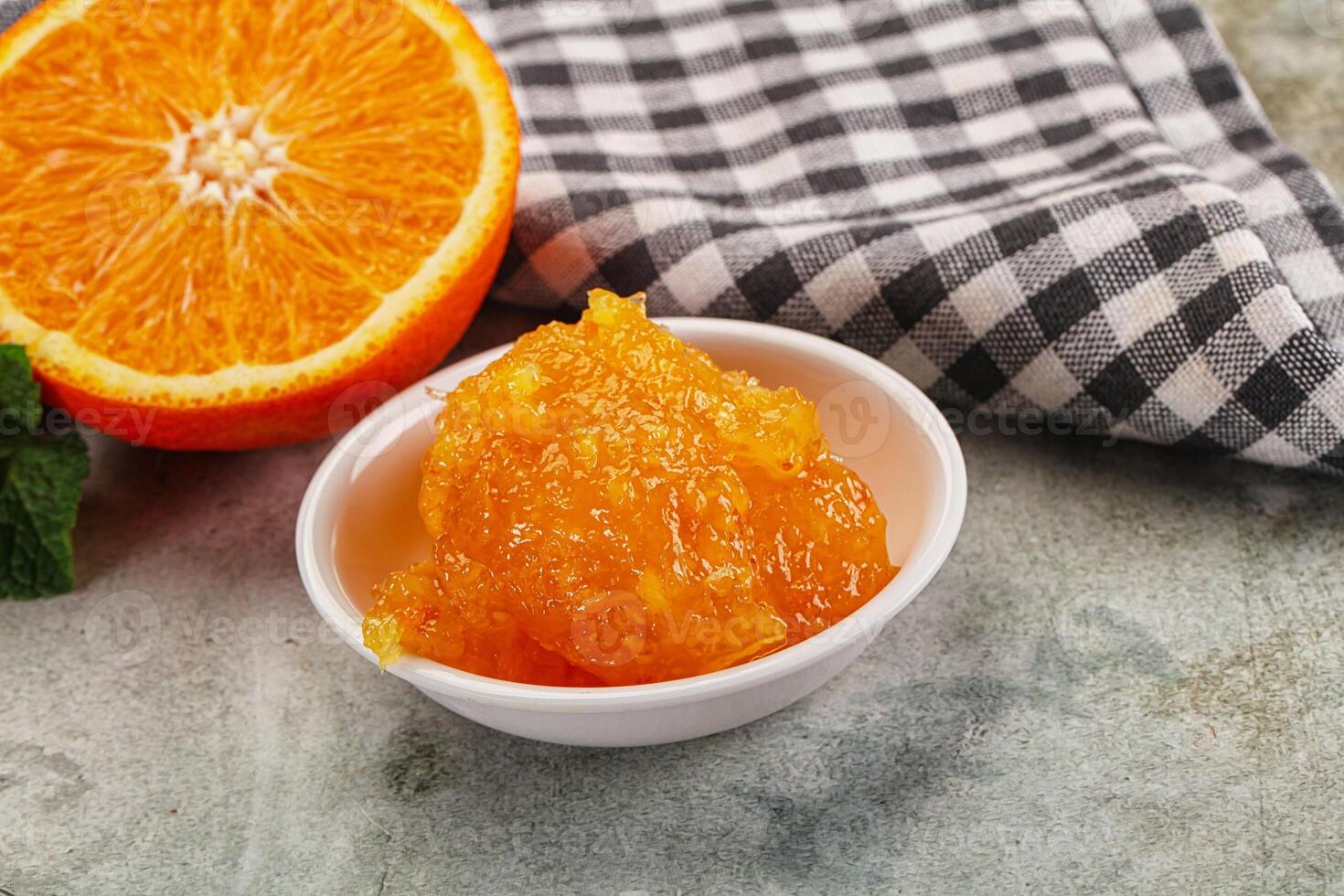 Tasty homemade Orange jam in the bowl photo
