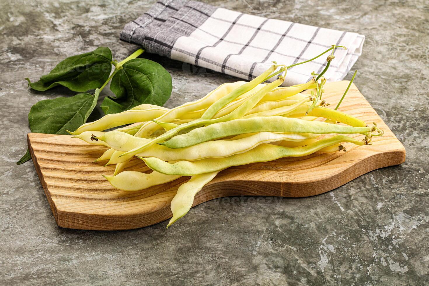Raw green bean strings heap photo