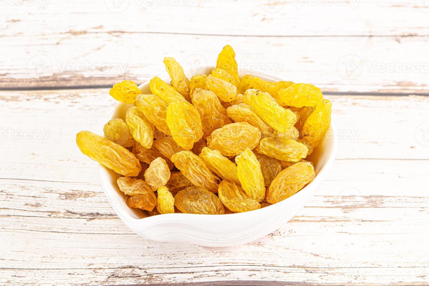 Yellow raisin - dry grape berries photo