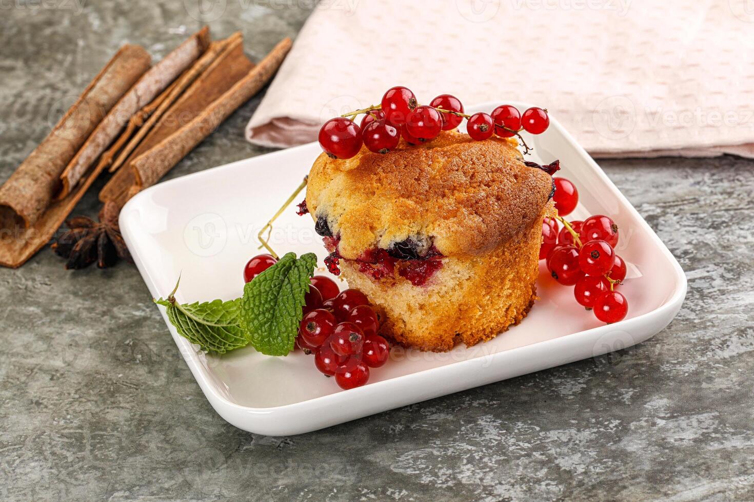 Delicous cupcake with red currant photo