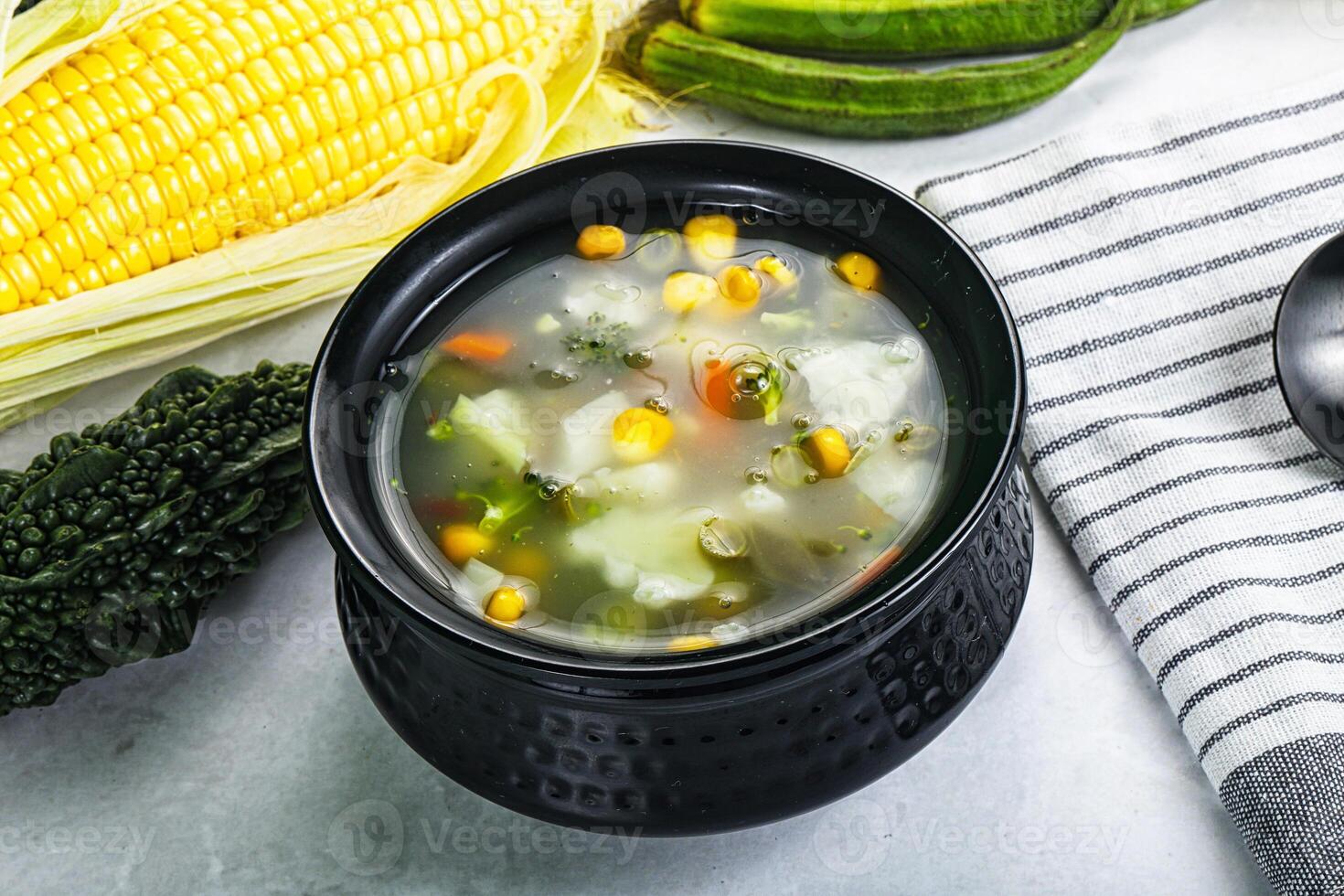 Soup with corn and broccoli photo