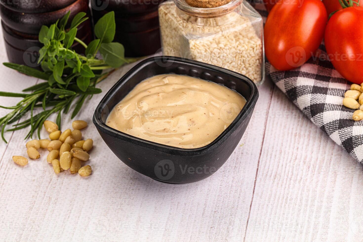 Delicious walnut creamy sauce in the bowl photo