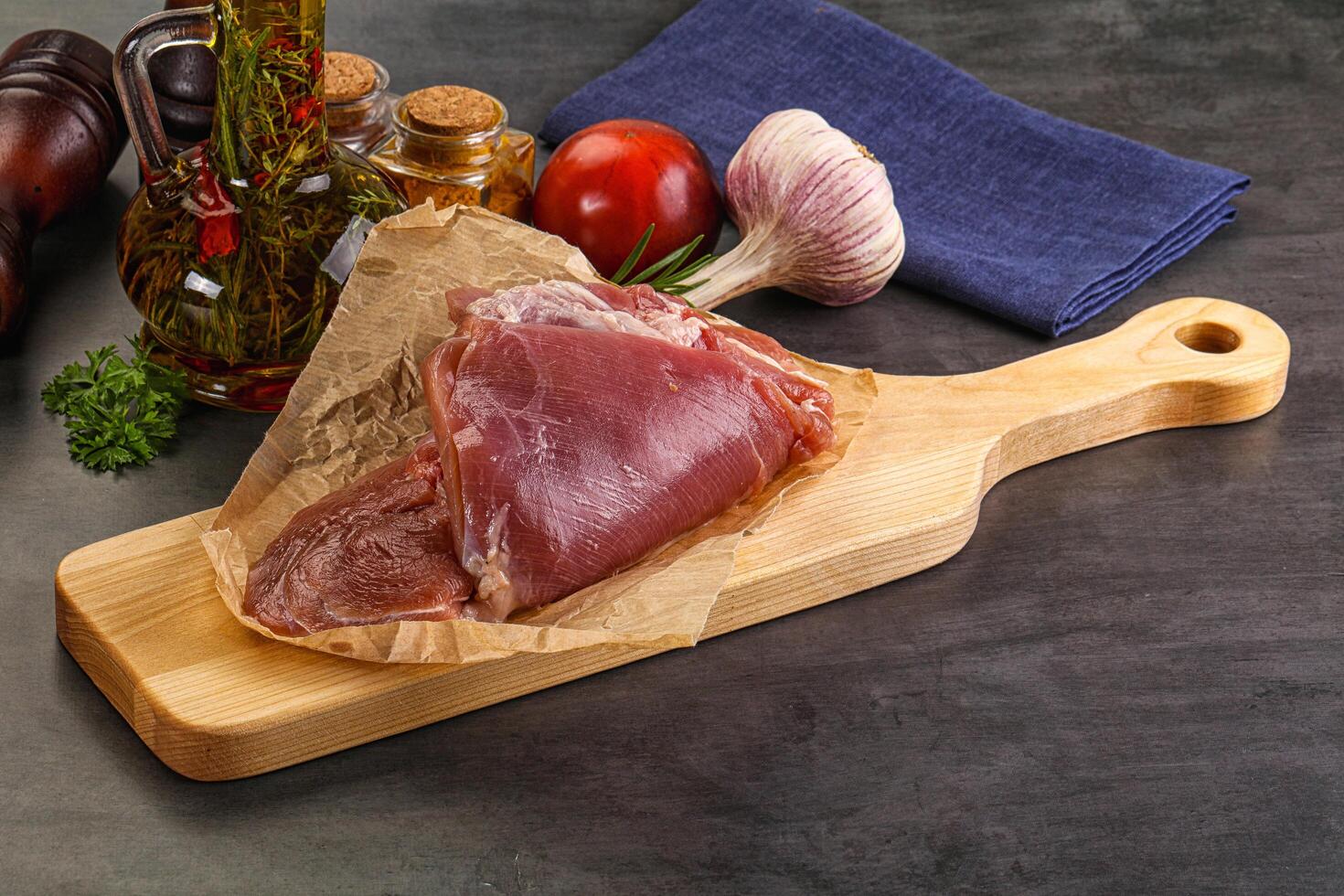 Raw uncooked turkey thigh fillet photo