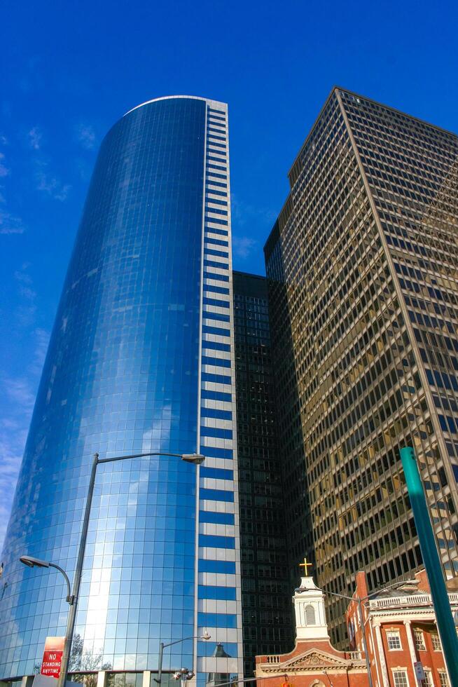 New York , USA - November 18, 2009 Manhattan skyscrapers, bottom-up view on blue sky background, USA photo