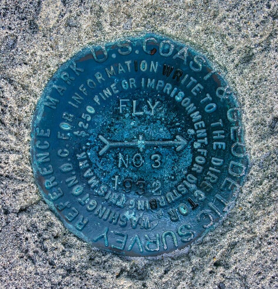 New Jersey, USA - November 19, 2009 US Coast and Geodetic Survey Reference Mark, cast iron sign on the coast in the suburbs of New Jersey, USA photo