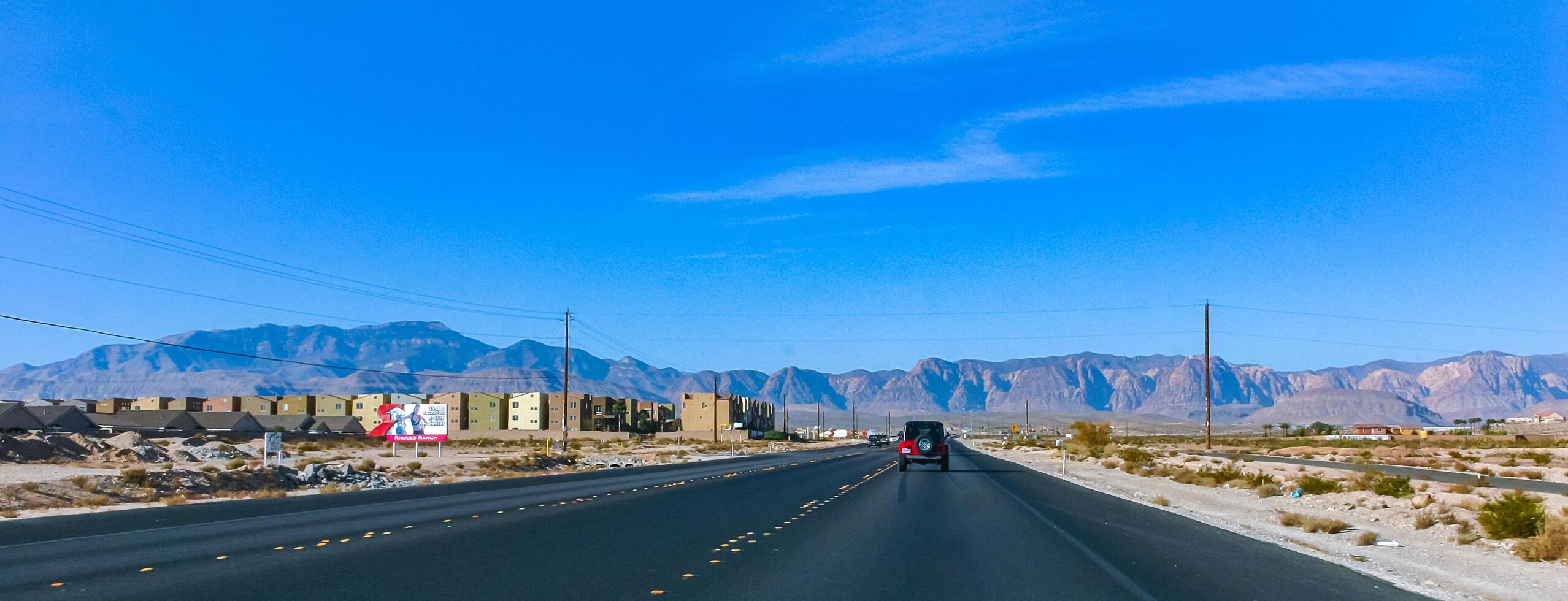 Suburban Las Vegas, California - November 21, 2009 wide road from Las Vegas towards the mountains to Death Valley National Park, California photo
