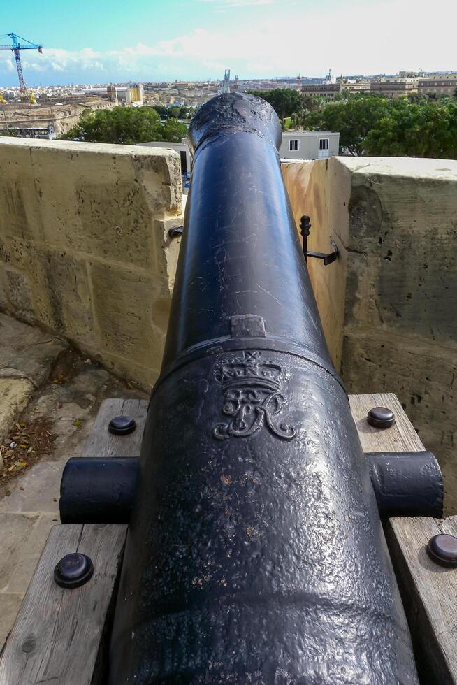 VALLETTA, MALTA - SEPTEMBER 14, 2012 Ancient cannon on the grounds of Hastings Gardens or Hastings Garden - public park and recreation area, Malta photo