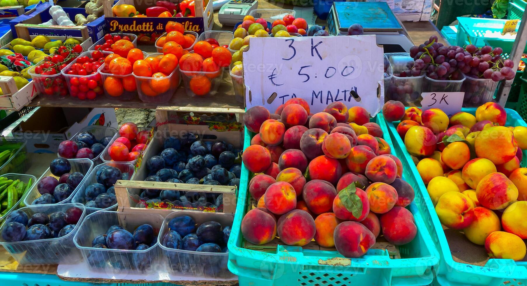 Traditional waterfront market in the Harbor of Mediterranean fishing village Marsaxlokk, Malta photo