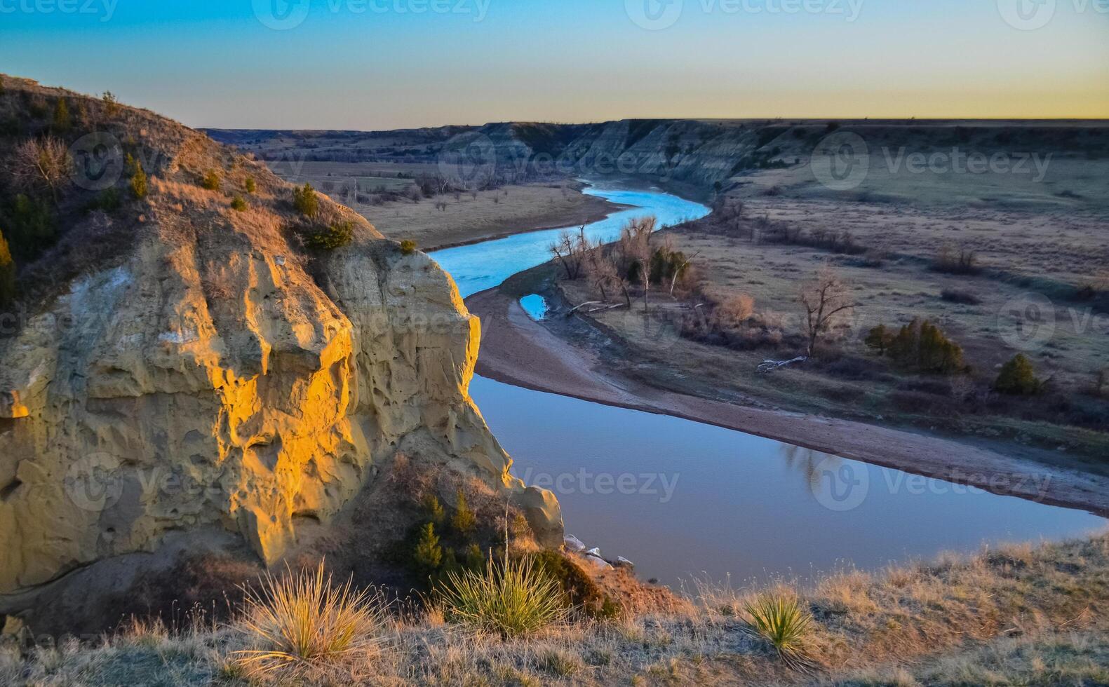 View of the winding river from the mountain in the evening at sunset. North Dakota photo