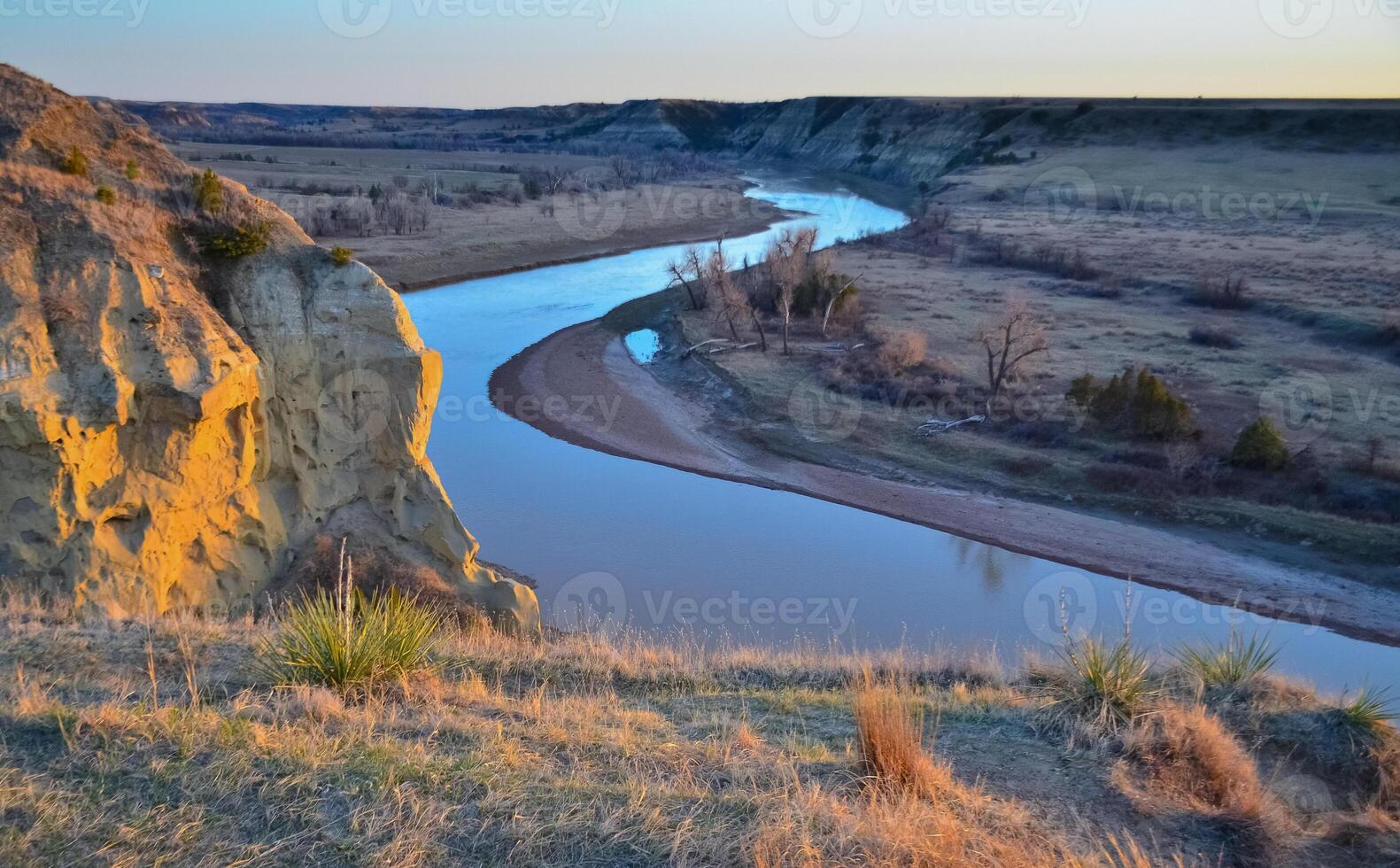 View of the winding river from the mountain in the evening at sunset. North Dakota photo