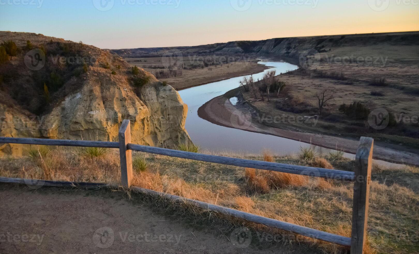 View of the winding river from the mountain in the evening at sunset. North Dakota photo