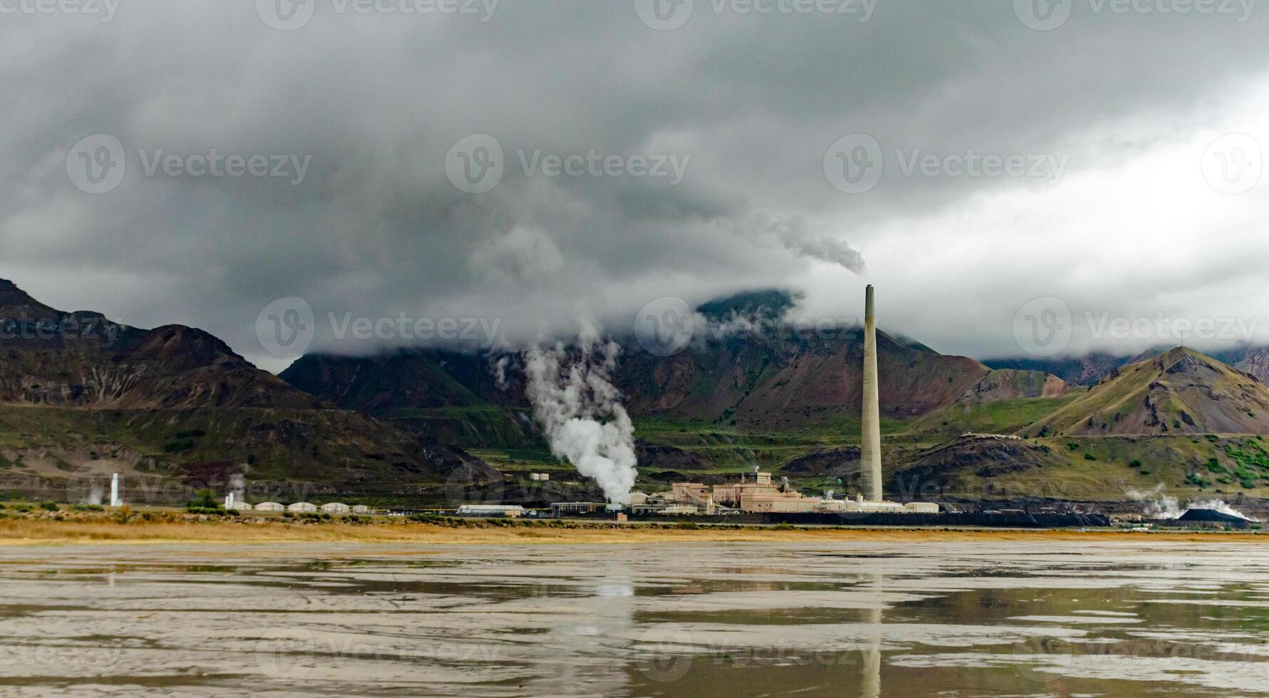 Oil refinery and a factory for obtaining silver on the shore photo