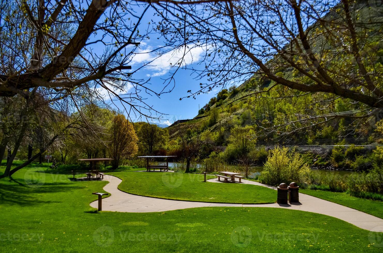 Table and benches in a recreation area near a small river in Utah, US photo