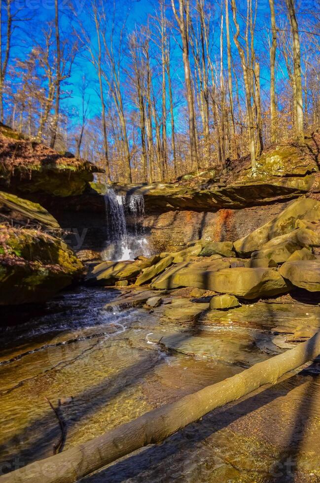 A small waterfall in the autumn in the forest in the parkon Brandywine Creek in Cuyahoga Valley National Park, Ohio. photo