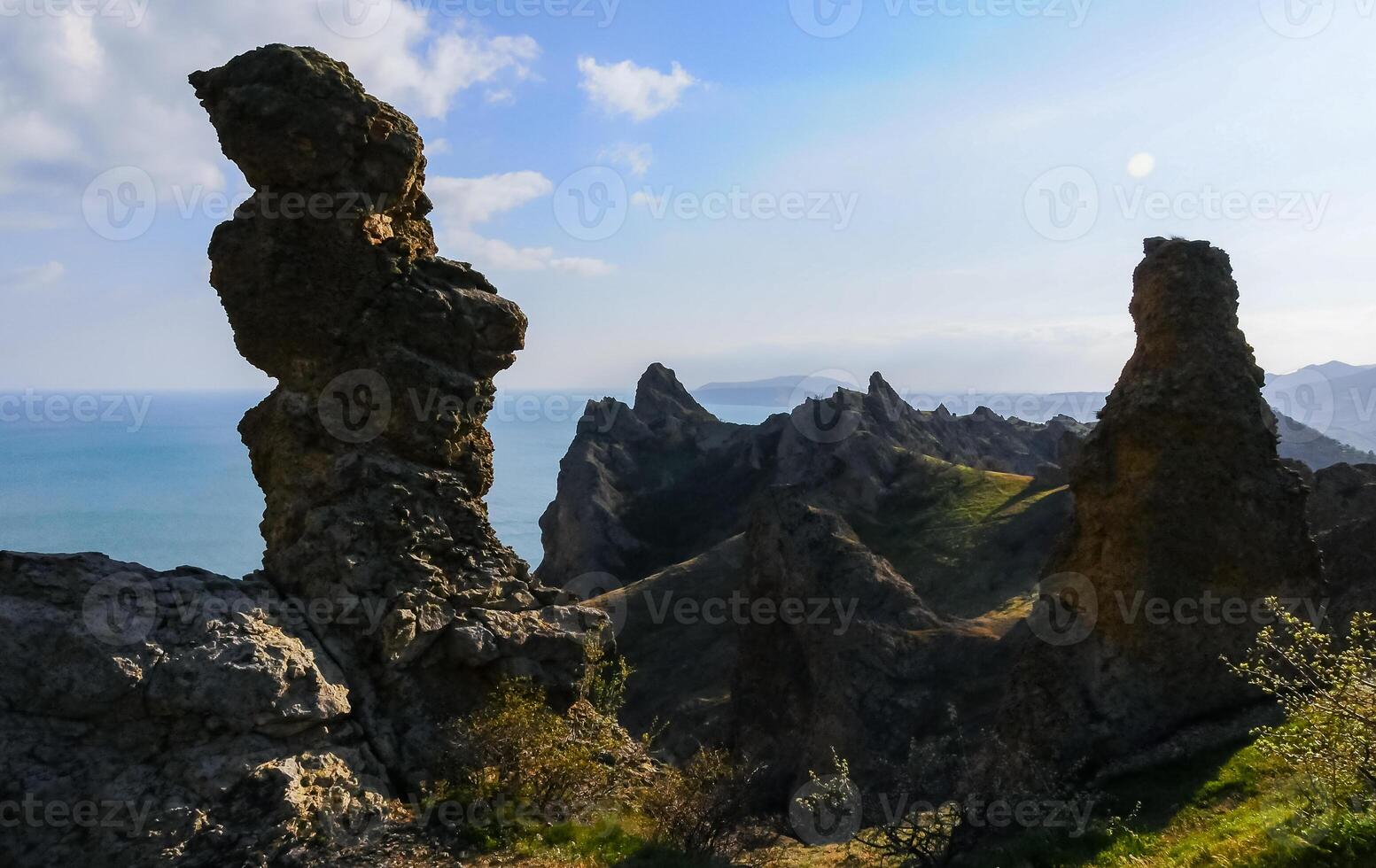 Mountain landscape, vertical weathered volcanic rocks on the slopes of the mountains photo