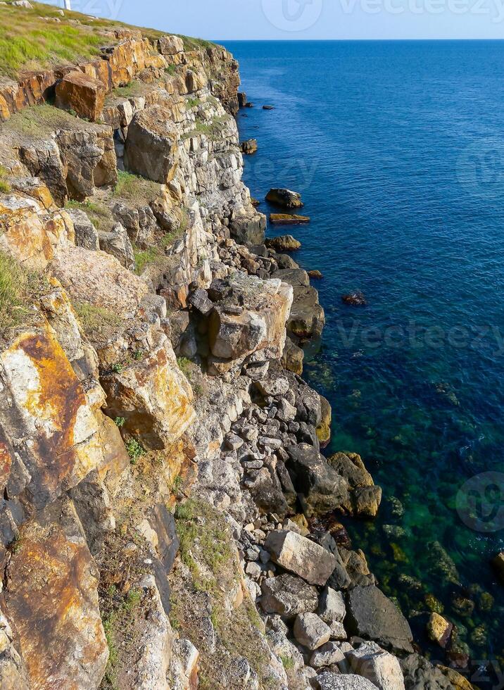 Coastal cliffs from the north side of Serpent's Zmeinyi Island, Ukraine photo