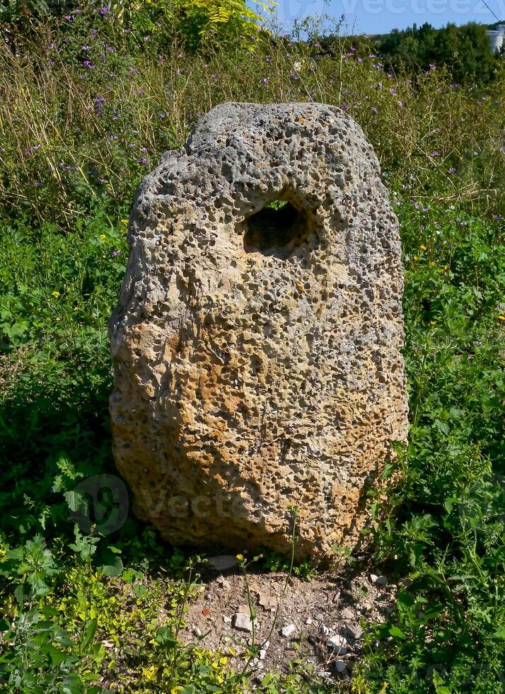 Ancient artifact, an ancient stone anchor, raised from the bottom of the Black Sea near Sozopol, Bulgaria photo