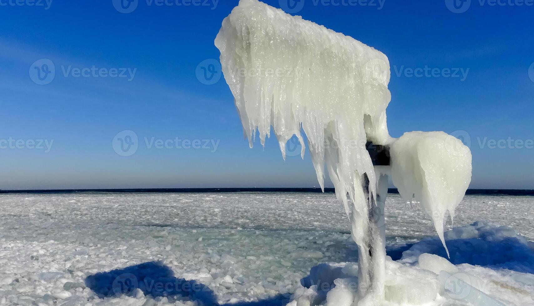 Frozen Black Sea, blocks of ice on the shore on the pier photo