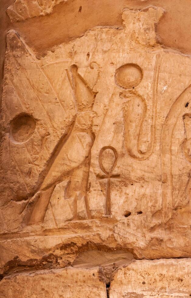 EGYPT, LUXOR - MARCH 01, 2019 ancient Egyptian hieroglyphs, drawings and inscriptions on the walls and columns in the temple of Karnak in Luxor photo