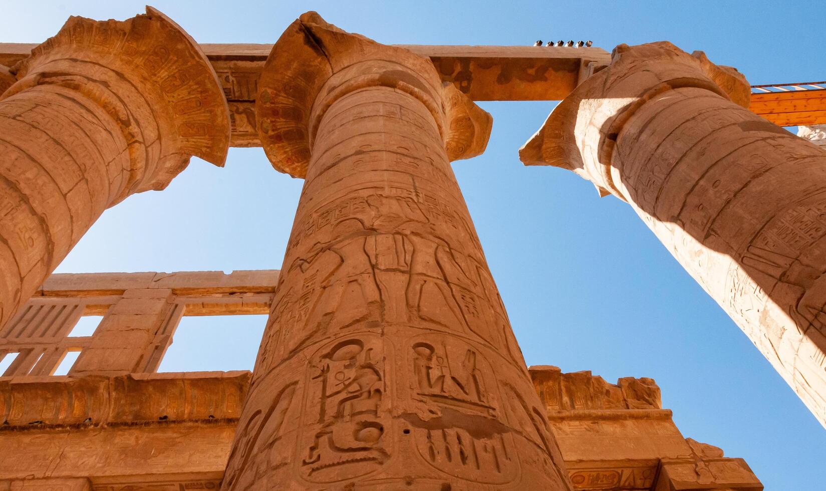 EGYPT, LUXOR - MARCH 01, 2019 ancient temple columns with hieroglyphs, drawings and inscriptions at Karnak in Luxor, Egypt photo