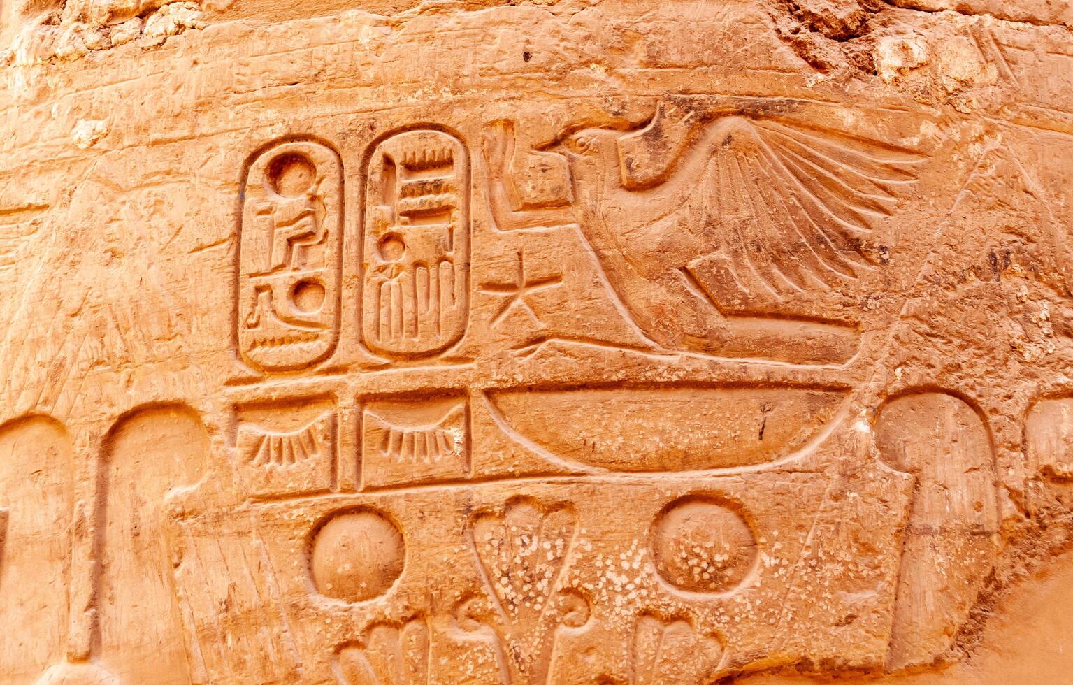 EGYPT, LUXOR - MARCH 01, 2019 ancient Egyptian hieroglyphs, drawings and inscriptions on the walls and columns in the temple of Karnak in Luxor photo