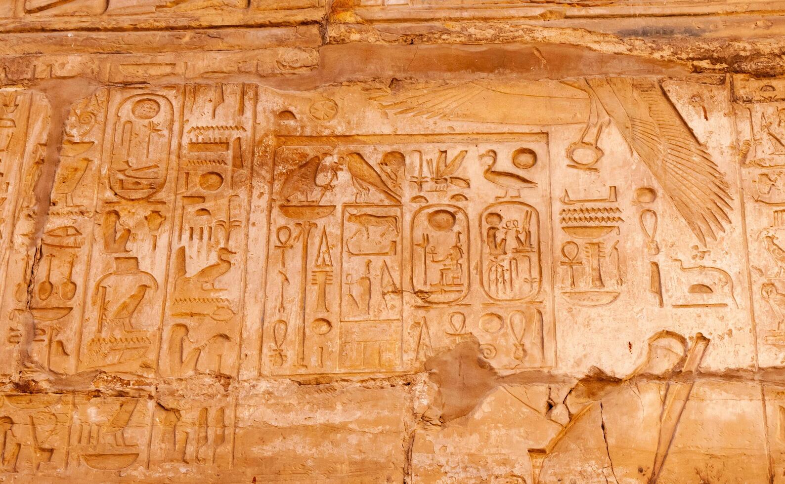 EGYPT, LUXOR - MARCH 01, 2019 ancient Egyptian hieroglyphs, drawings and inscriptions on the walls and columns in the temple of Karnak in Luxor photo