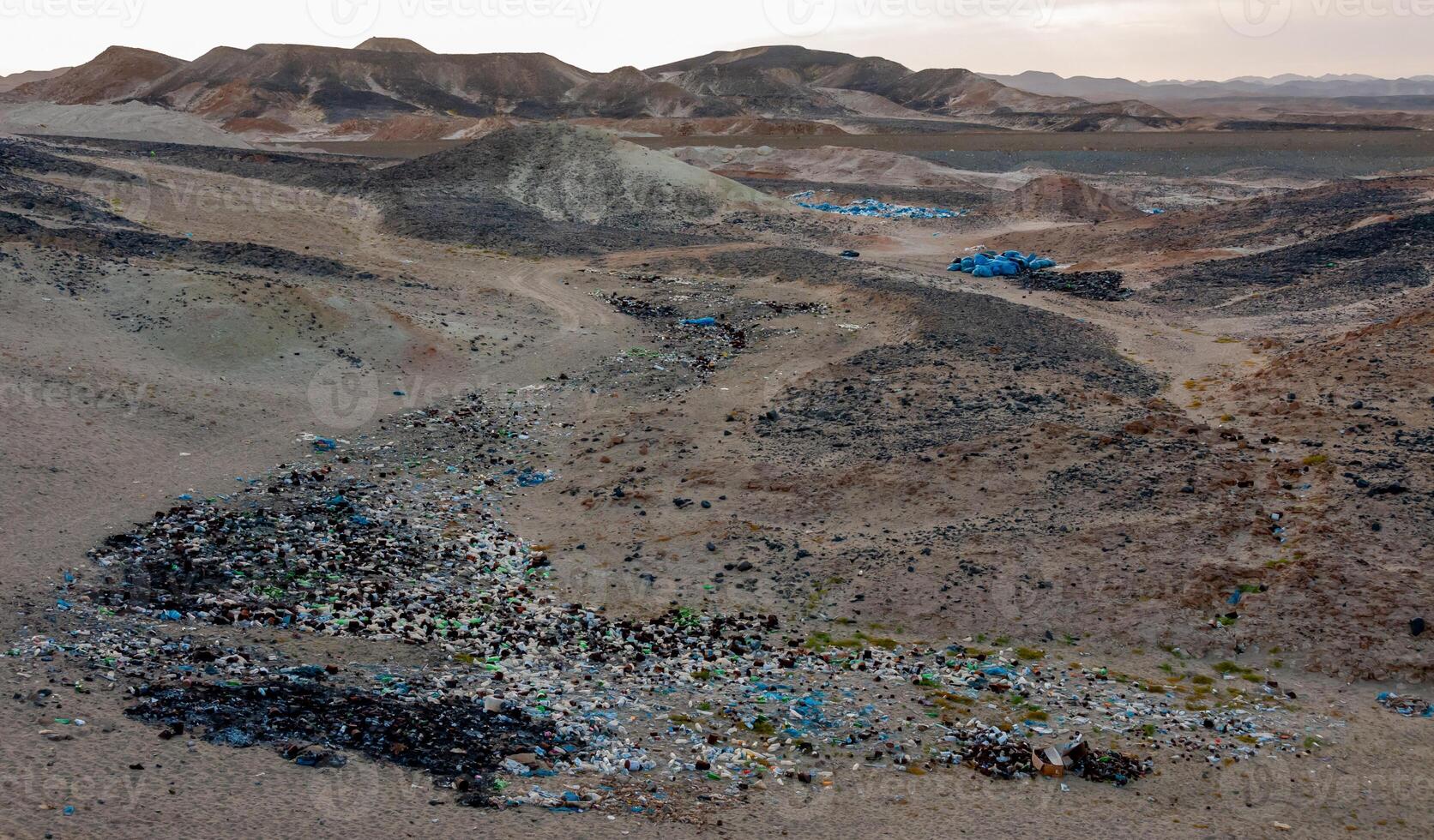 Plastic bottles and various garbage from hotels in the wild, Garbage dump in the desert in Egypt photo