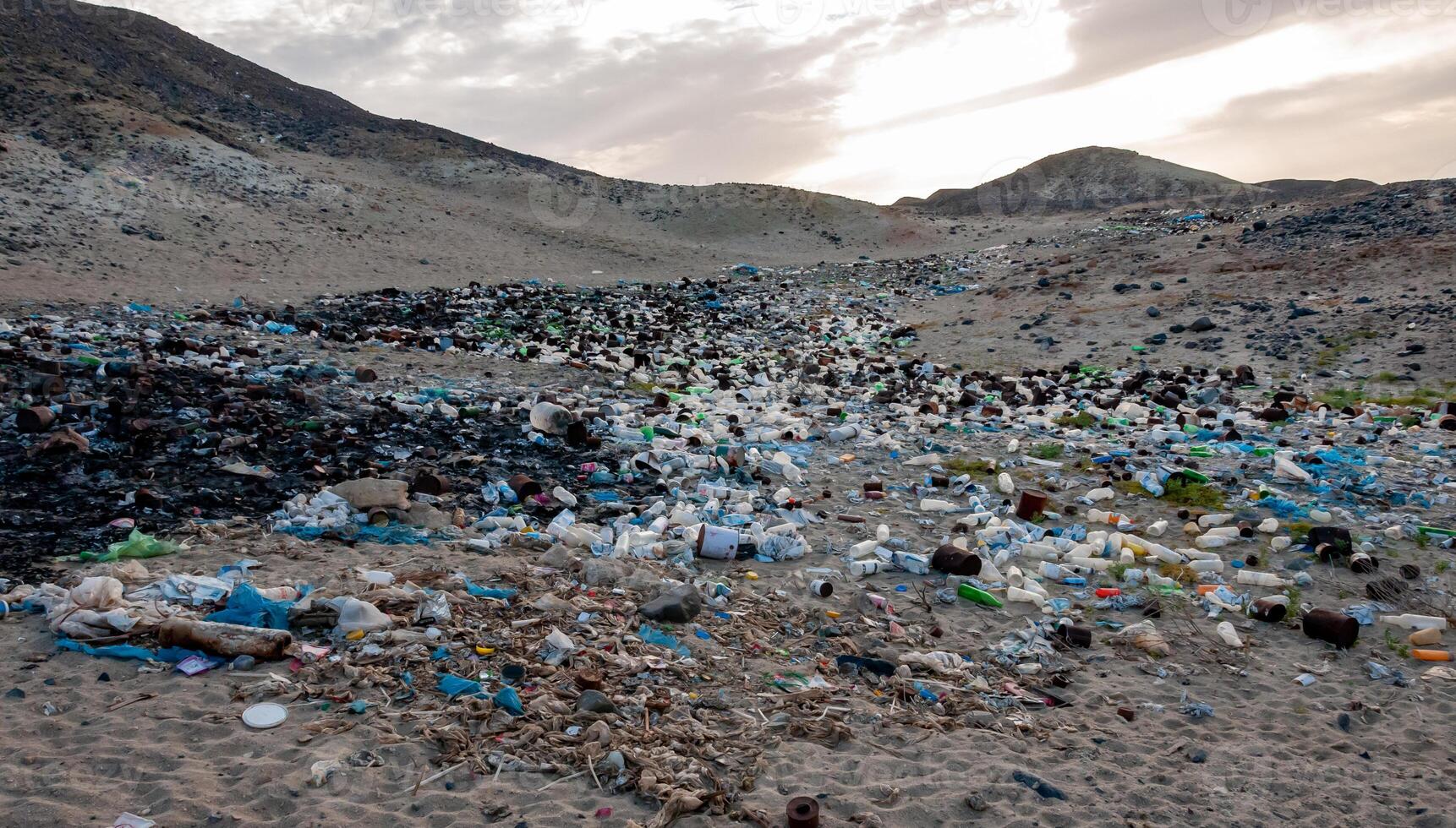 Plastic bottles and various garbage from hotels in the wild, Garbage dump in the desert in Egypt photo