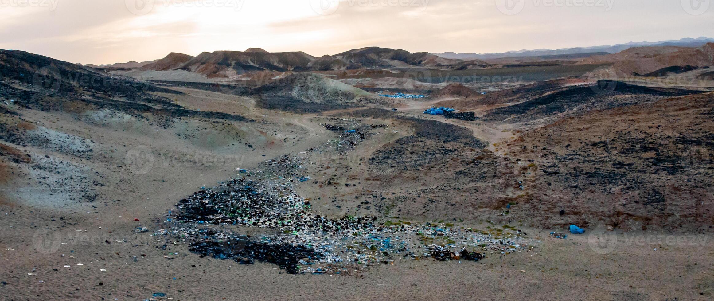 Plastic bottles and various garbage from hotels in the wild, Garbage dump in the desert in Egypt photo
