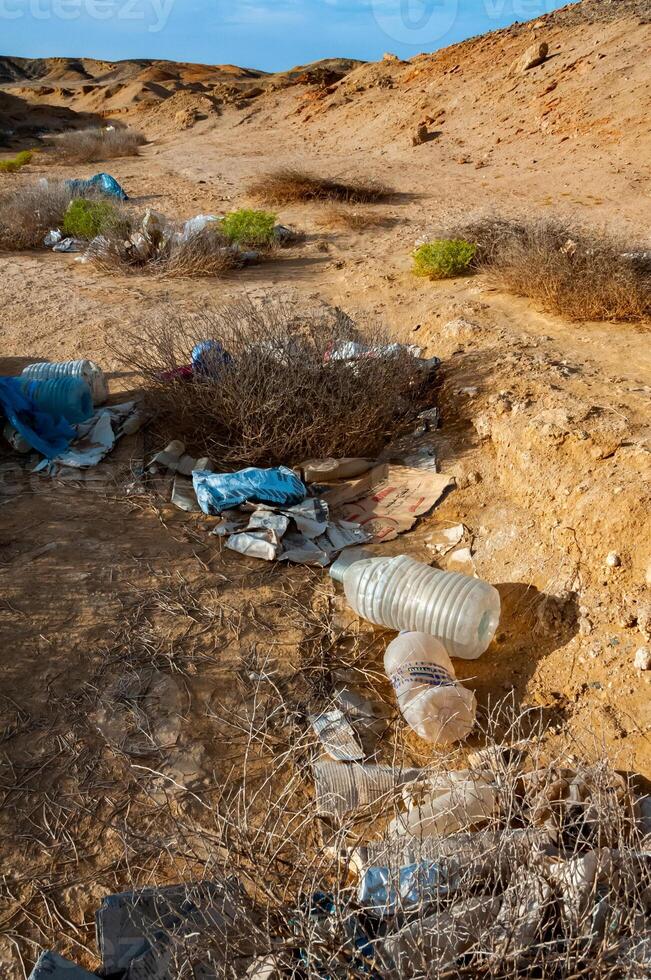 Plastic bottles and various garbage from hotels in the wild, Garbage dump in the desert in Egypt photo