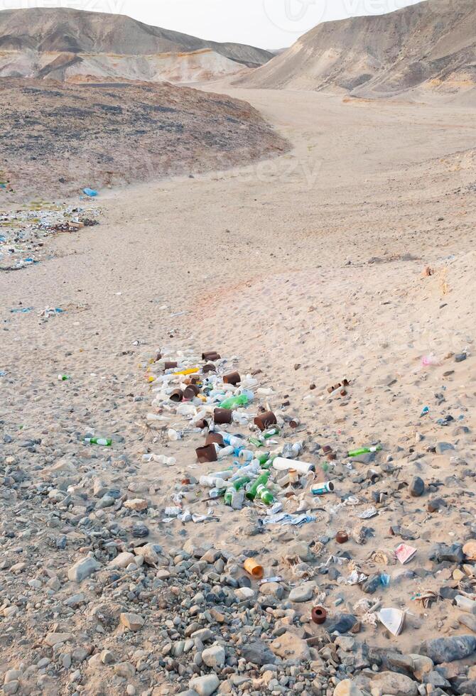 Plastic bottles and various garbage from hotels in the wild, Garbage dump in the desert in Egypt photo