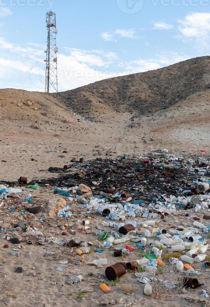 Plastic bottles and various garbage from hotels in the wild, Garbage dump in the desert in Egypt photo