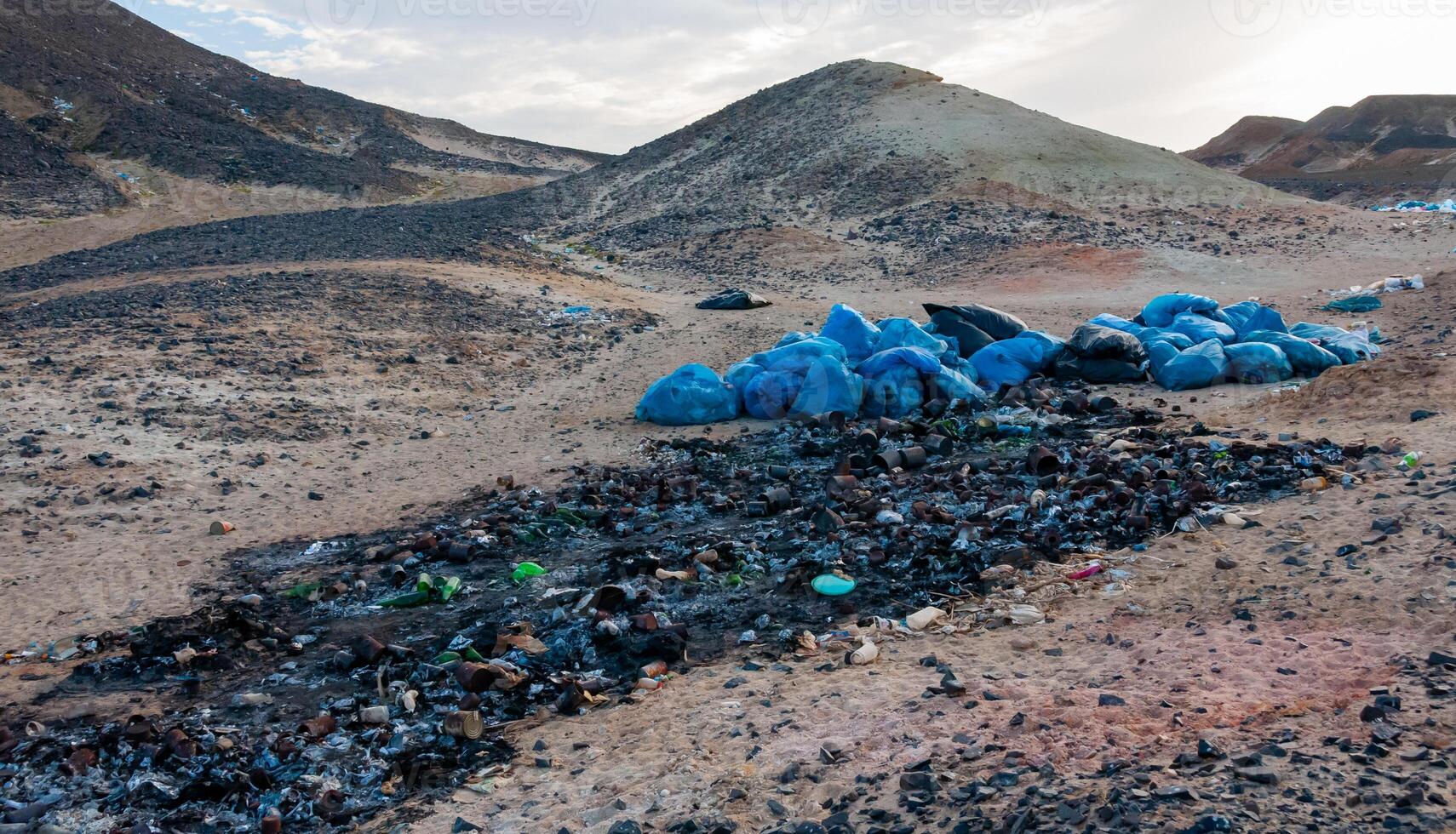 Plastic bottles and various garbage from hotels in the wild, Garbage dump in the desert in Egypt photo