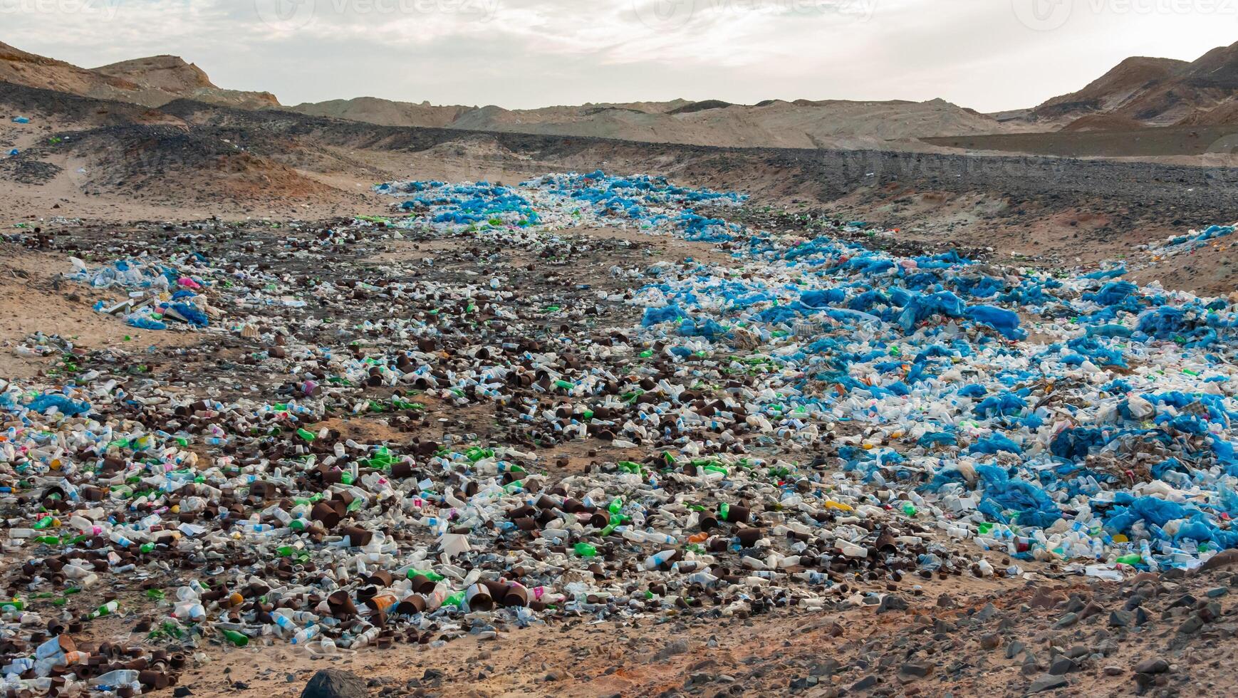 Plastic bottles and various garbage from hotels in the wild, Garbage dump in the desert in Egypt photo