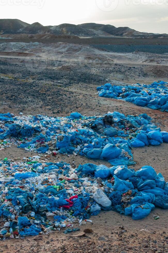 Plastic bottles and various garbage from hotels in the wild, Garbage dump in the desert in Egypt photo