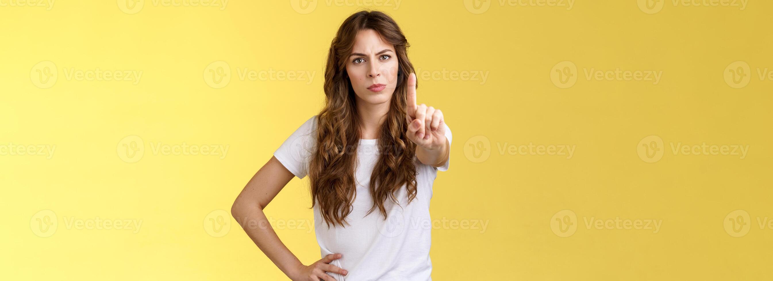 Not on my watch. Serious-looking confident empowered woman protect female rights extend index finger shaking no prohibition taboo gesture not giving permition behave cruel forbid displeased face photo