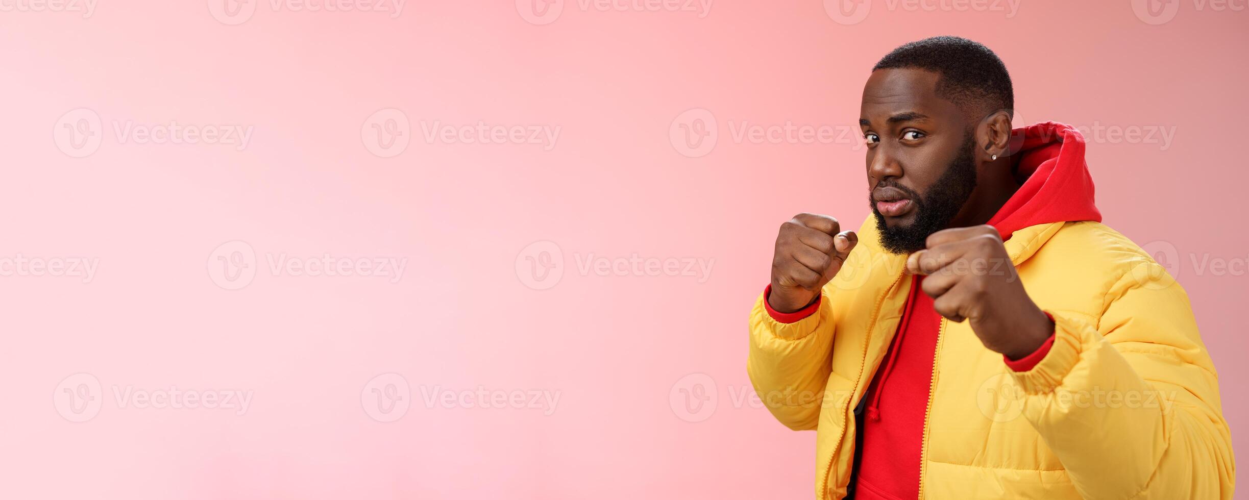 Better not mess me. Portrait serious-looking strong african-american boyfriend stand for girlfriend raising fists ready defend boxing pose wanna punch offender, standing pink background photo