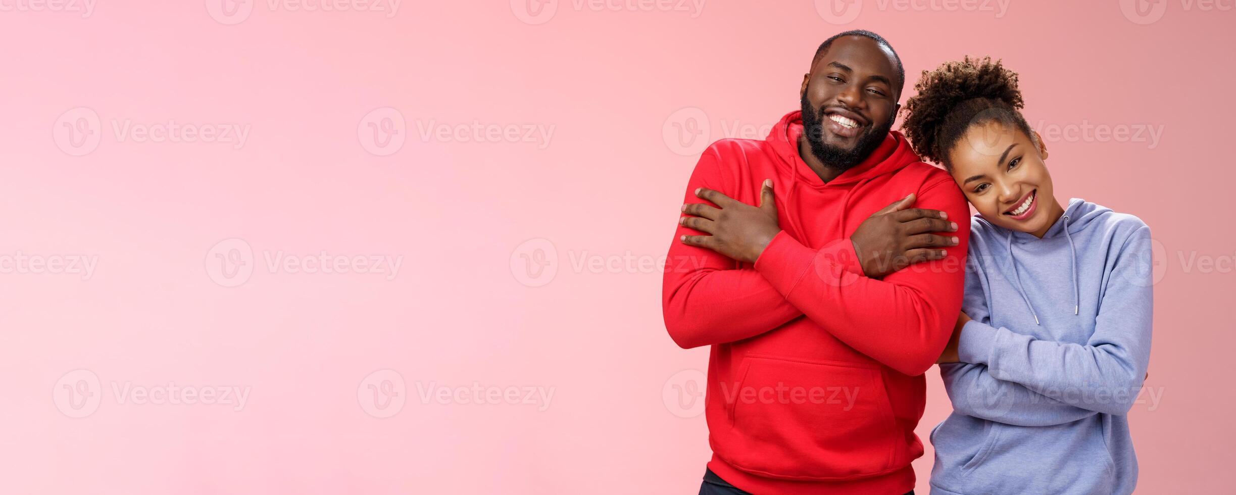 Charming happy sincere african-american family guy girl relationship embracing cross arms chest hugging each other girlfriend lean boyfriend shoulder lovely couply smiling feel love warmth photo