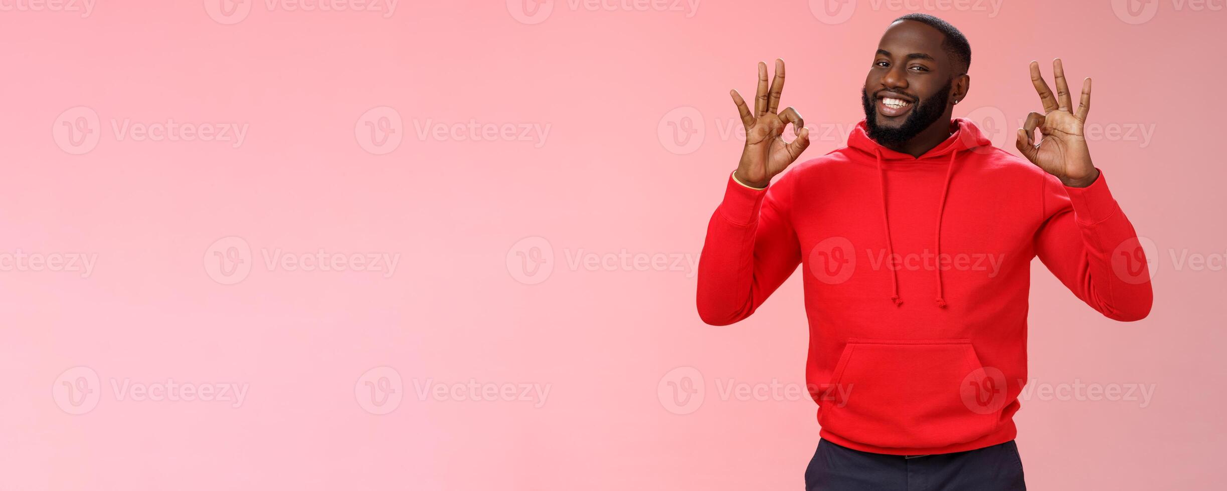 Guy promise perfection. Portrait confident charismatic pleasant african american man show okay no problem gesture say okay smiling assuring everything cool, standing pink background delighted photo