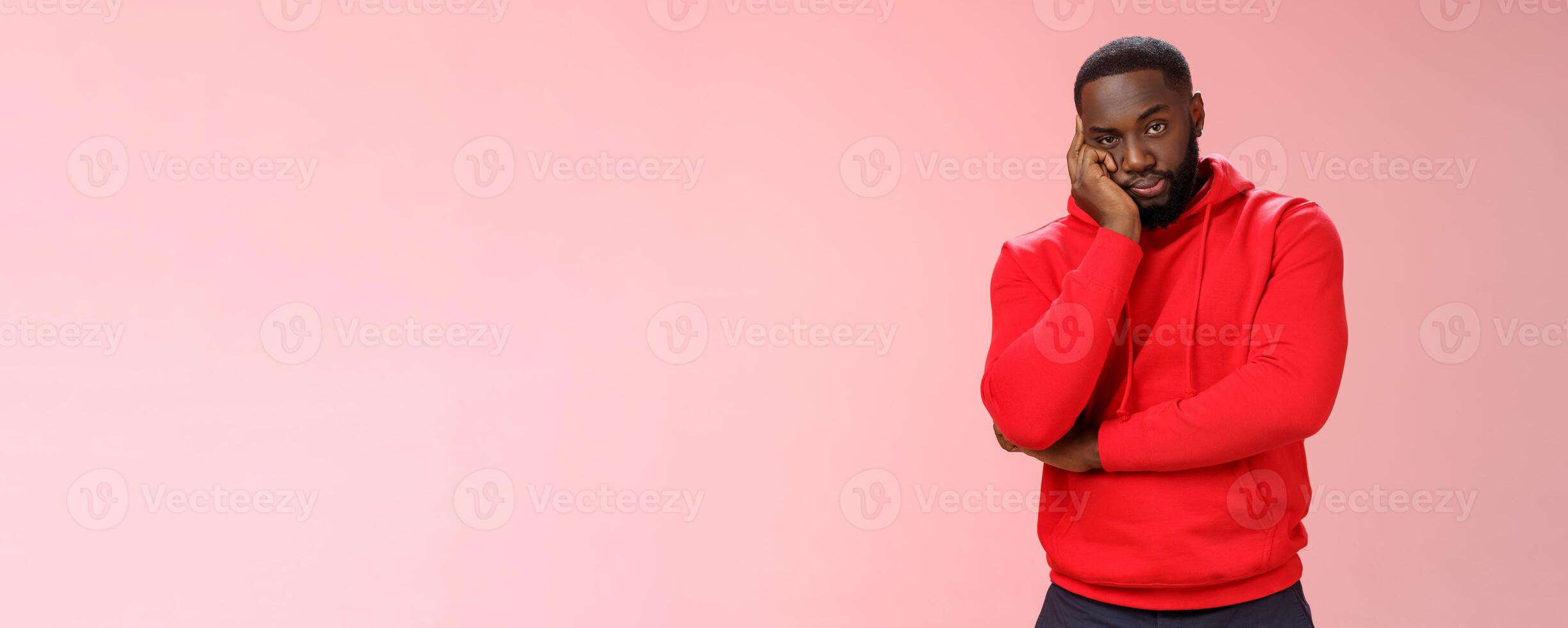 Bored annoyed african-american guy look sceptical dying boredom cannot wait go home lean head palm raise eyebrow judgemental ignorant, standing bothered irritated pink background photo