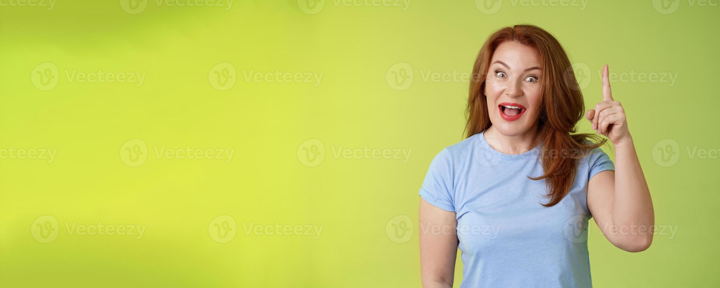 Got excellent idea solution up there. Excited smart creative middle-aged mature woman ginger hair raise index finger eureka pointing top explain offer terms smiling describe cool advertisement photo