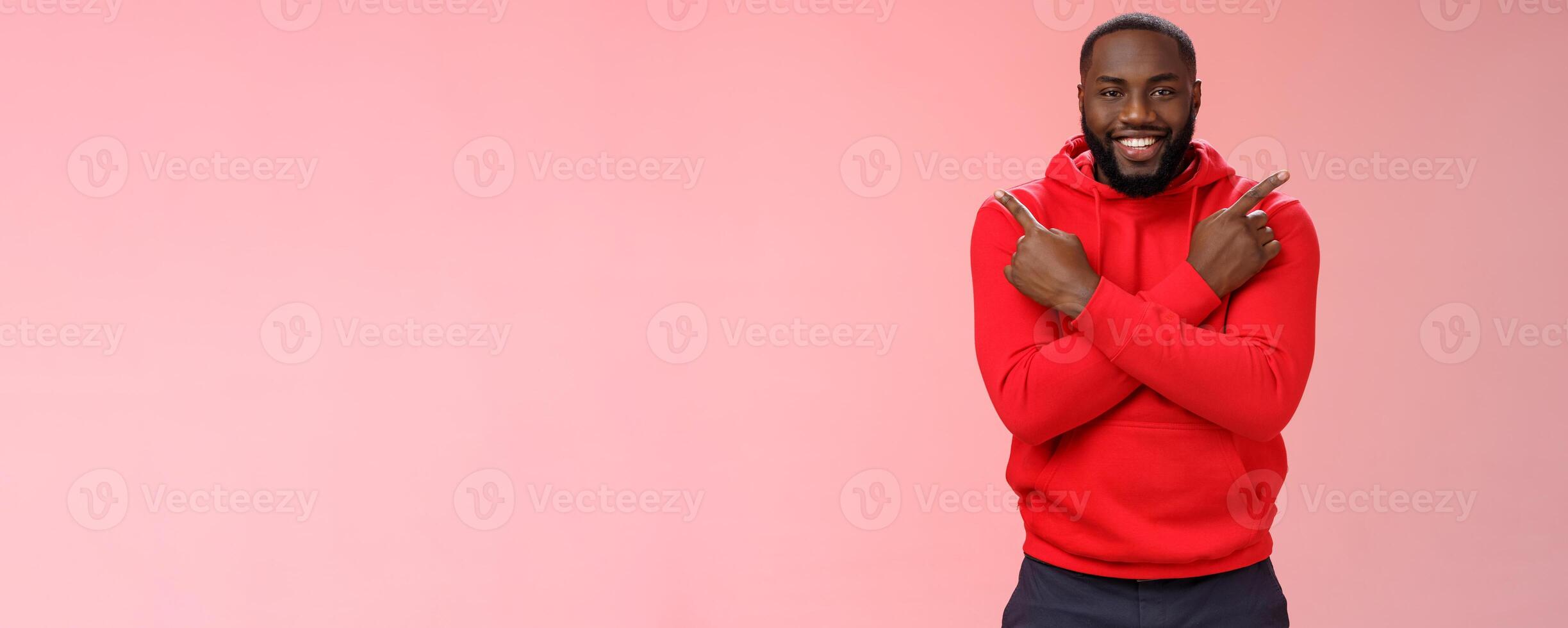 Happy handsome bearded boyfriend pointing different sides cross fingers left right smiling happily asking girlfriend opinion advice what choice make, proposing opportunities variety products photo