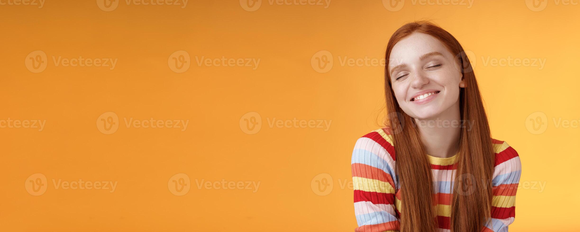 Tender sensual dreamy cute redhead feminine girl dreaming about tasty slice pizza close eyes smiling delighted drooling standing fascinated mesmerized recalling lovely moment, orange background photo