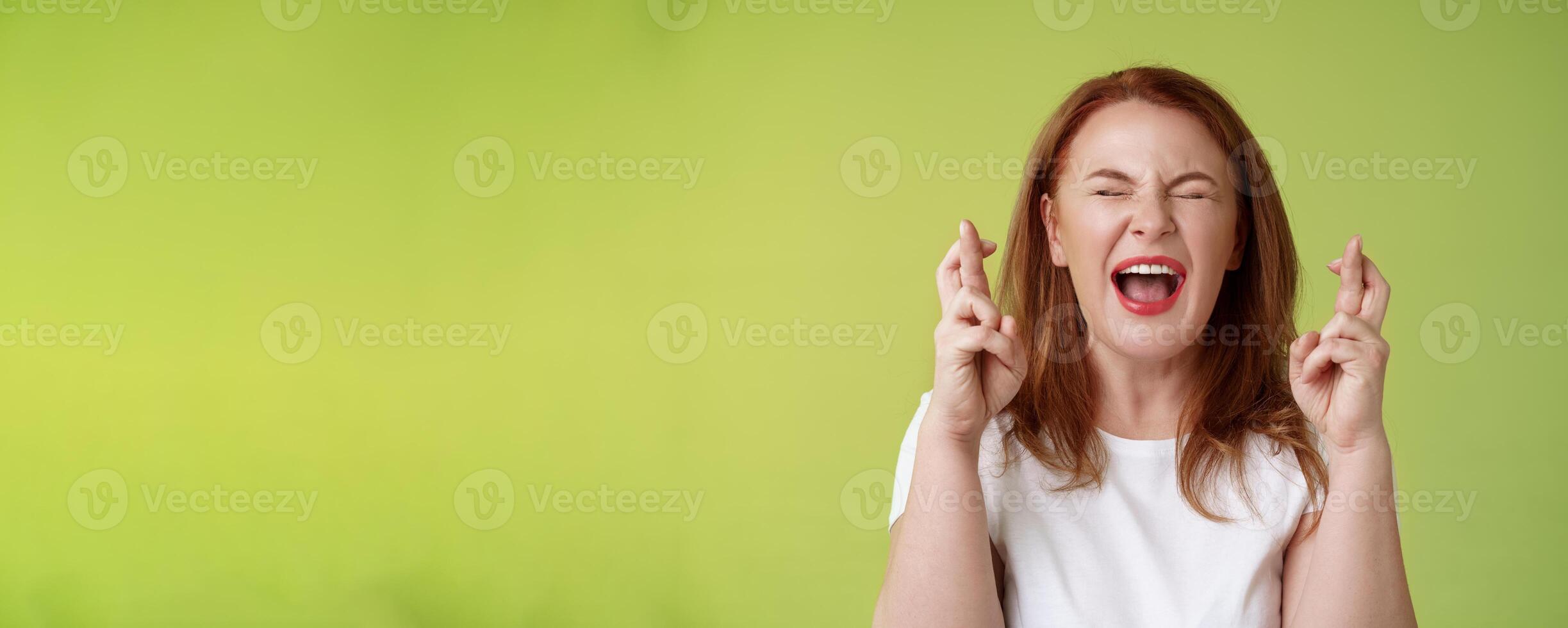 Woman implore god protection. Close eyes yelling thrilled cross fingers good luck making wish desire come true hopefully plead lord help belief positive vibe power supplication anticipating results photo
