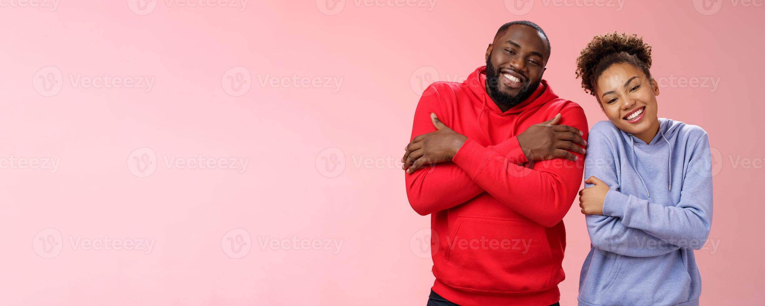 Two african american man woman couple feel comfortable warm together embracing each other cuddling happily tilting head look cute express love strong healthy relationship, smiling delighted photo