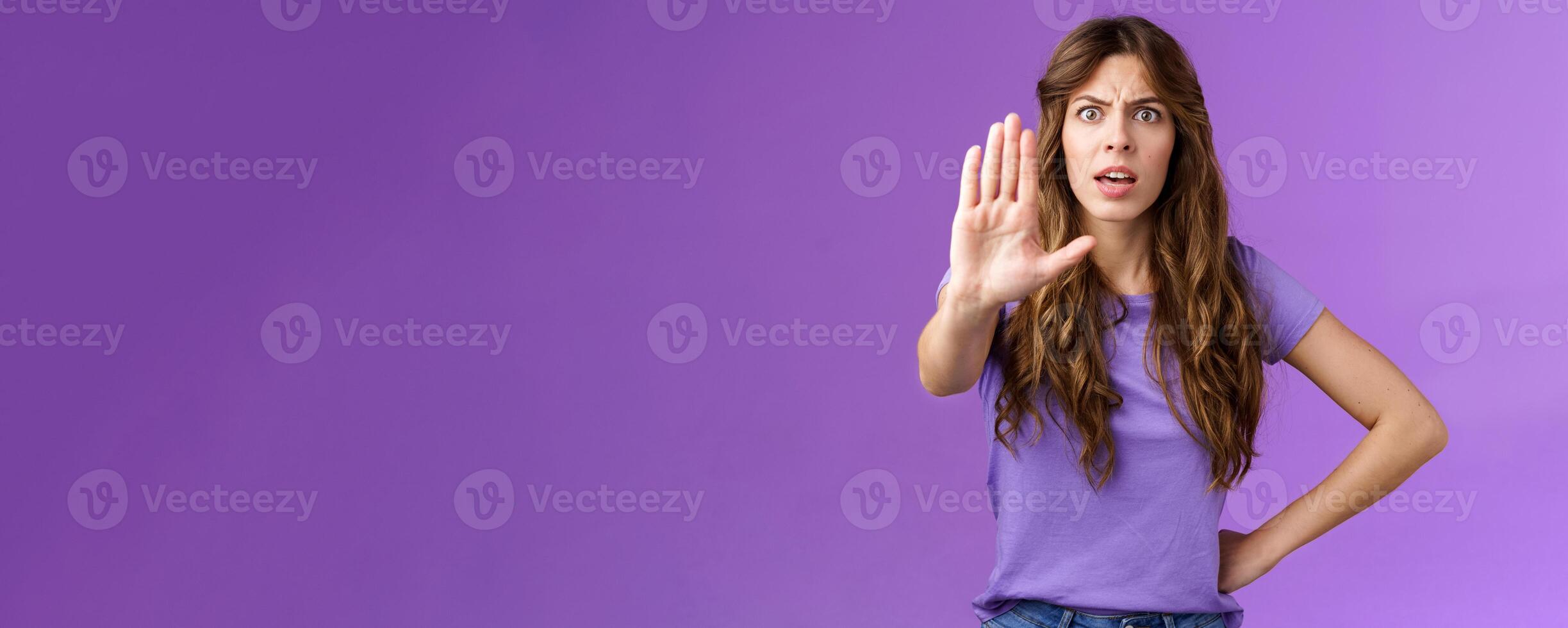 Serious-looking displeased assertive female friend stand confident demand stop smoking pull palm camera forbid disapproval gesture restrain you making bad choice purple background photo