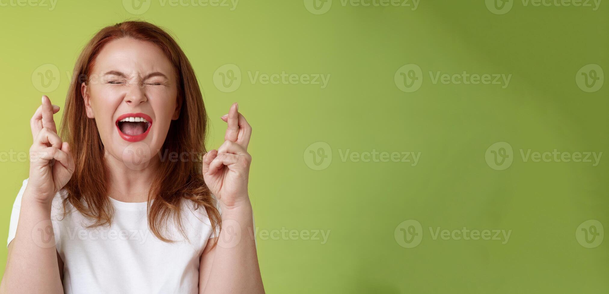 Woman implore god protection. Close eyes yelling thrilled cross fingers good luck making wish desire come true hopefully plead lord help belief positive vibe power supplication anticipating results photo