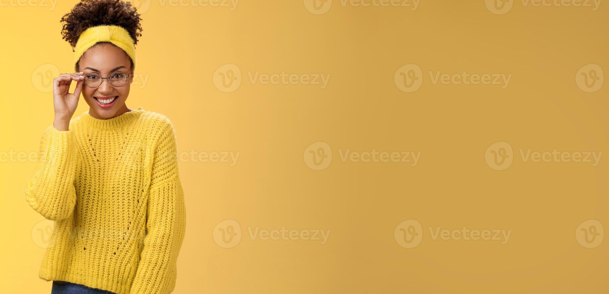 Attractive friendly charismatic female programmer frontend developer smiling broadly check glasses nose look confident lucky have excellent idea improve app workability, standing yellow background photo