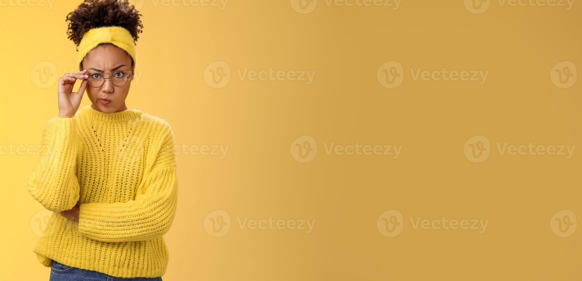 Suspicious strict serious-looking attractive clever african-american female student check glasses smirking disapproval frowning displeased bad classmate behaviour standing doubtful look disbelief photo