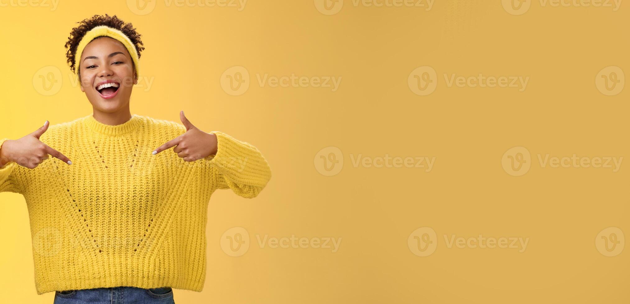 Confident good-looking outgoing black cute girl 20s in sweater headband afro hairstyle pointing heself raise head arrogant laughing bragging telling own personal goals achievements, suggest herself photo